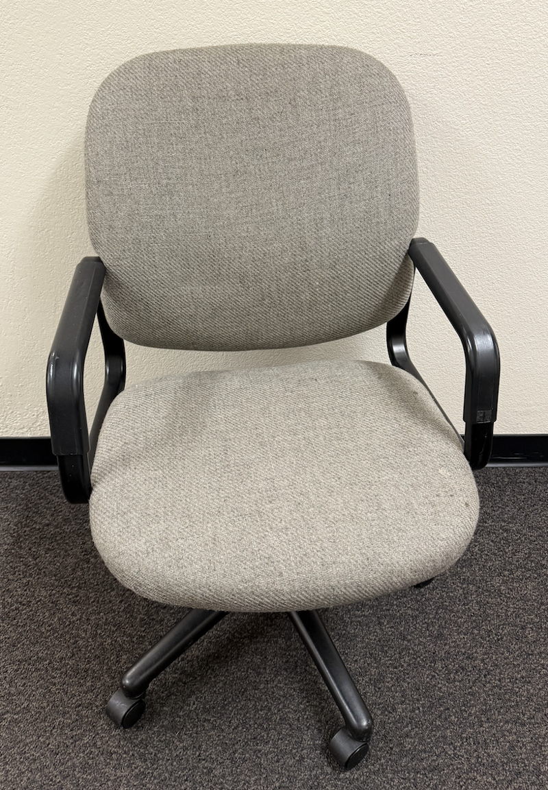 Grey fabric office chair with black armrests and base